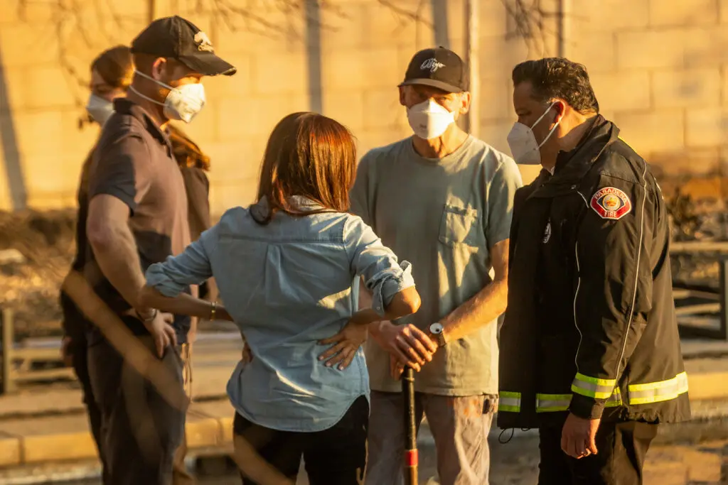 Harry and Meghan comfort fire survivors.